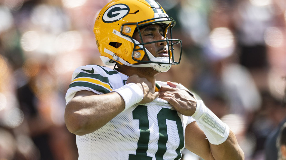 Green Bay Packers quarterback Jordan Love (10) adjusts his jersey during warm ups before the game against the Cleveland Browns at Huntington Bank Field.