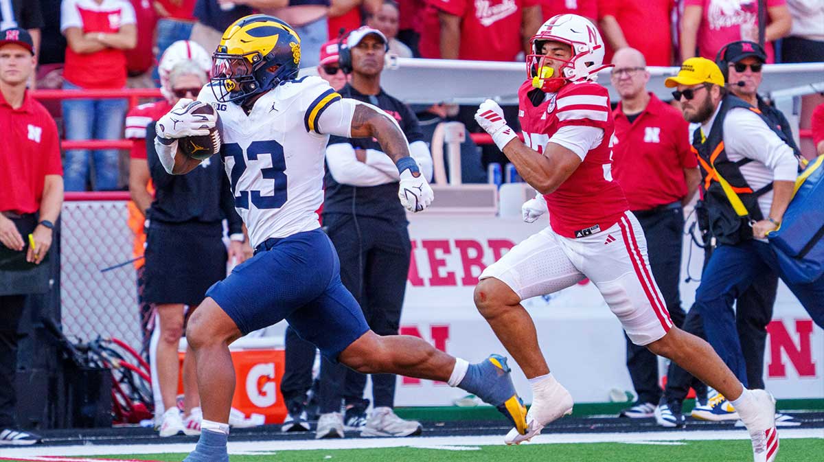 Michigan Wolverines running back Jordan Marshall (23) runs for a touchdown against Nebraska Cornhuskers defensive back Donovan Jones (37) during the third quarter at Memorial Stadium.