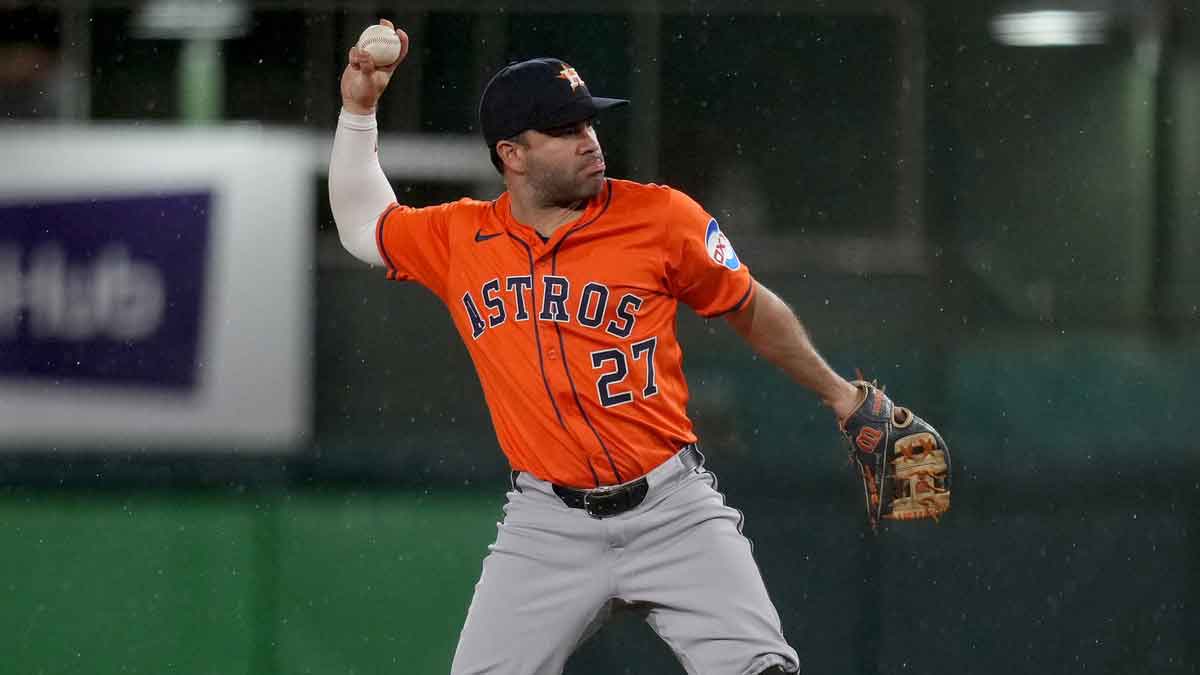 Houston Astros second baseman Jose Altuve (27) throws the ball to first to record an out against the Athletics in the seventh inning at Sutter Health Park.