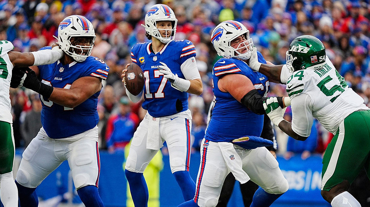 Buffalo Bills quarterback Josh Allen (17) gets pass protection from Buffalo Bills guard O'Cyrus Torrence (64) and Buffalo Bills guard Connor McGovern (66) during first half action at the Bills home game against the New York Jets at Highmark Stadium in Orchard Park on Dec. 29, 2024.