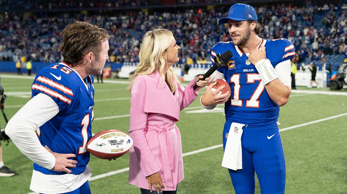 Buffalo Bills quarterback Josh Allen (17) is interviewed by NBC sideline reporter Melissa Stark along with place kicker Matt Prater (15) after the game between the Baltimore Ravens and Buffalo Bills at Highmark Stadium.