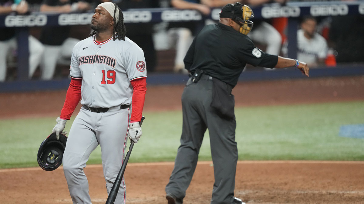 Washington Nationals first baseman Josh Bell (19) walks back to the dugout after striking out looking while pinch-hitting in the eighth inning against the Miami Marlins at loanDepot Park.