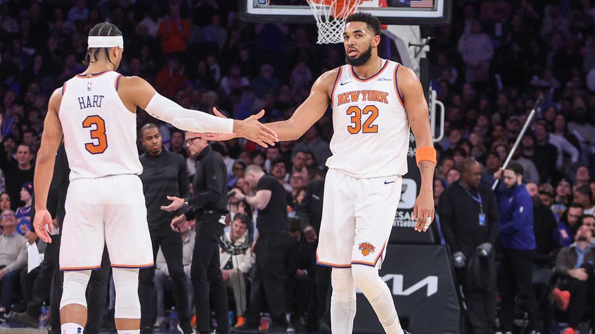 New York Knicks center Karl-Anthony Towns (32) is greeted by guard Josh Hart (3) during a timeout in the second quarter against the Atlanta Hawks at Madison Square Garden.