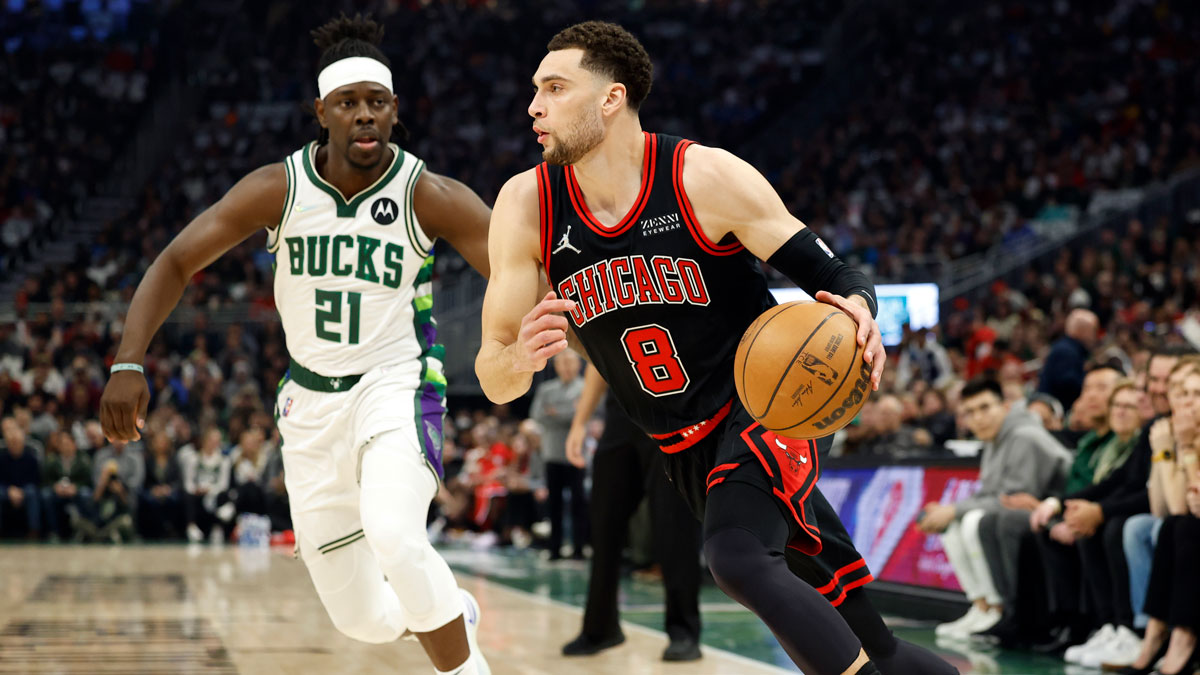 Chicago Bulls guard Zach LaVine (8) drives for the basket in front of Milwaukee Bucks guard Jrue Holiday (21) during the first quarter during game one of the first round for the 2022 NBA playoffs at Fiserv Forum.