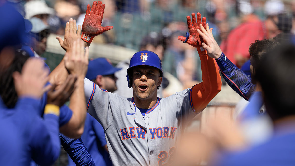 New York Mets right fielder Juan Soto (22) celebrates in the dugout after hitting a grand slam home run against the Detroit Tigers in the fourth inning