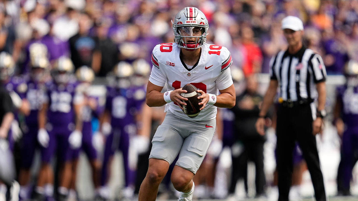 Ohio State Buckeyes quarterback Julian Sayin (10) runs during the first half of the NCAA football game against the Washington Huskies at Husky Stadium in Seattle, Washington.