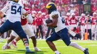Michigan Wolverines running back Justice Haynes (22) runs for a touchdown against the Nebraska Cornhuskers during the second quarter at Memorial Stadium.