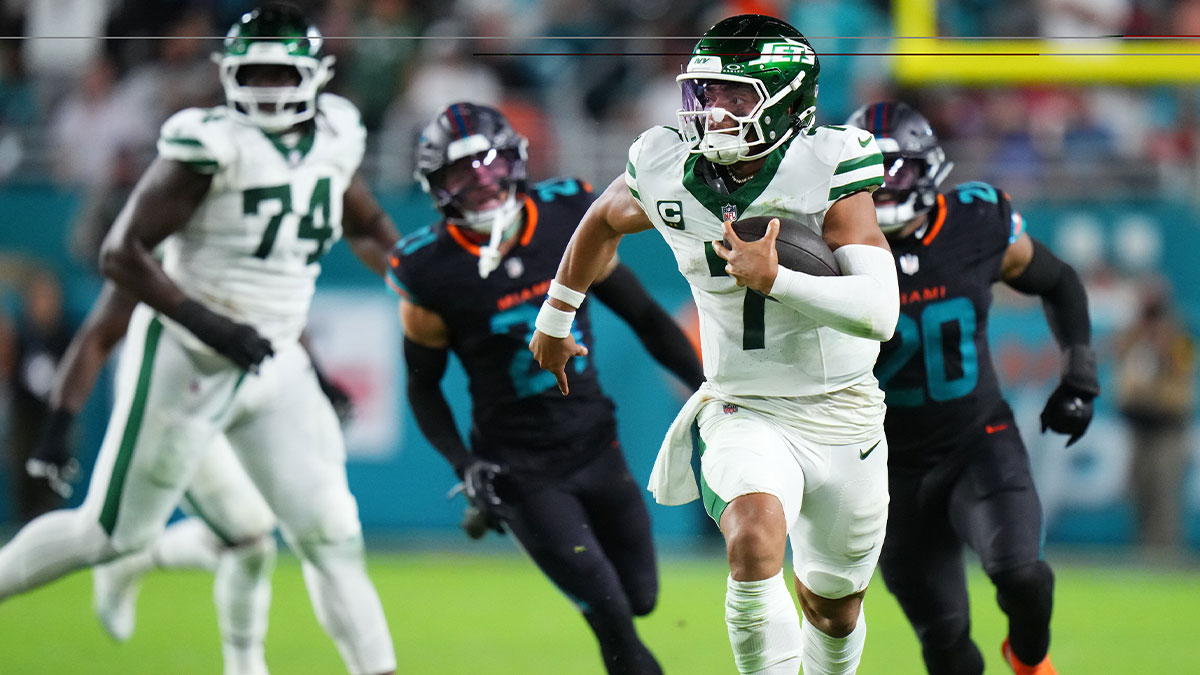 New York Jets quarterback Justin Fields (7) rushes the ball against the Miami Dolphins during the second half at Hard Rock Stadium.