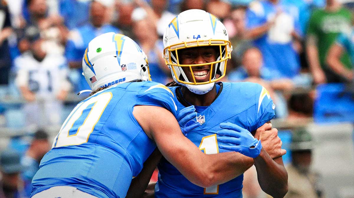 Los Angeles Chargers wide receiver Quentin Johnston (1) celebrates with quarterback Justin Herbert (10) after scoring a touchdown in the first quarter at Bank of America Stadium.