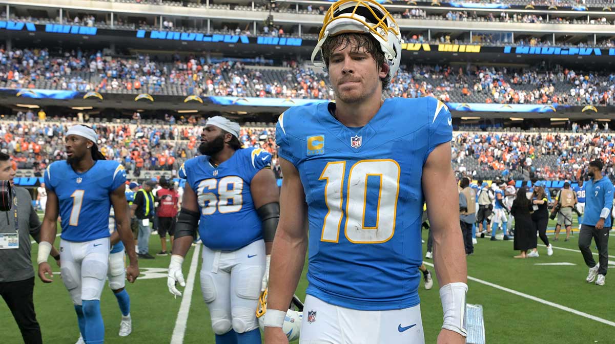 Los Angeles Chargers quarterback Justin Herbert (10) leaves the field after defeating the Denver Broncos 23-20 at SoFi Stadium.
