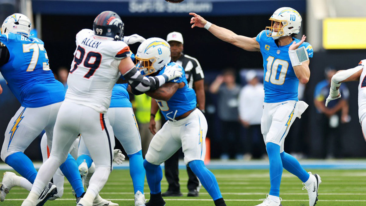 Los Angeles Chargers quarterback Justin Herbert (10) makes a pass during the first half against the Denver Broncos at SoFi Stadium.