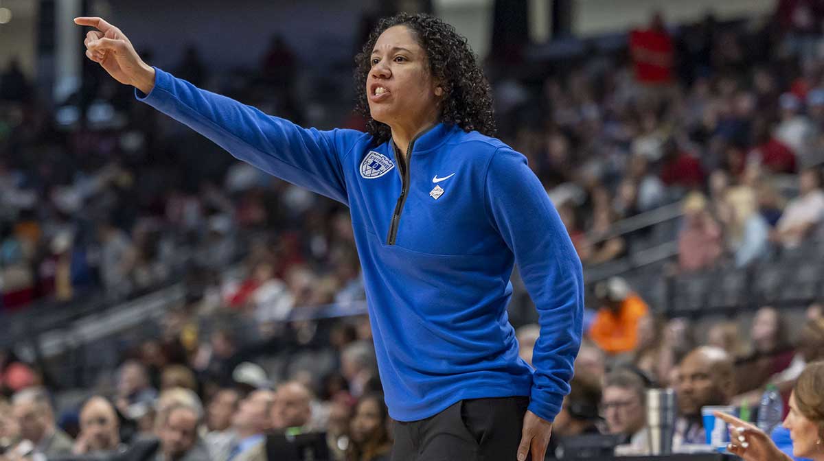 Duke Blue Devils head coach Kara Lawson signals to her team during the Sweet 16 NCAA Tournament basketball game against the North Carolina Tar Heelsat Legacy Arena.
