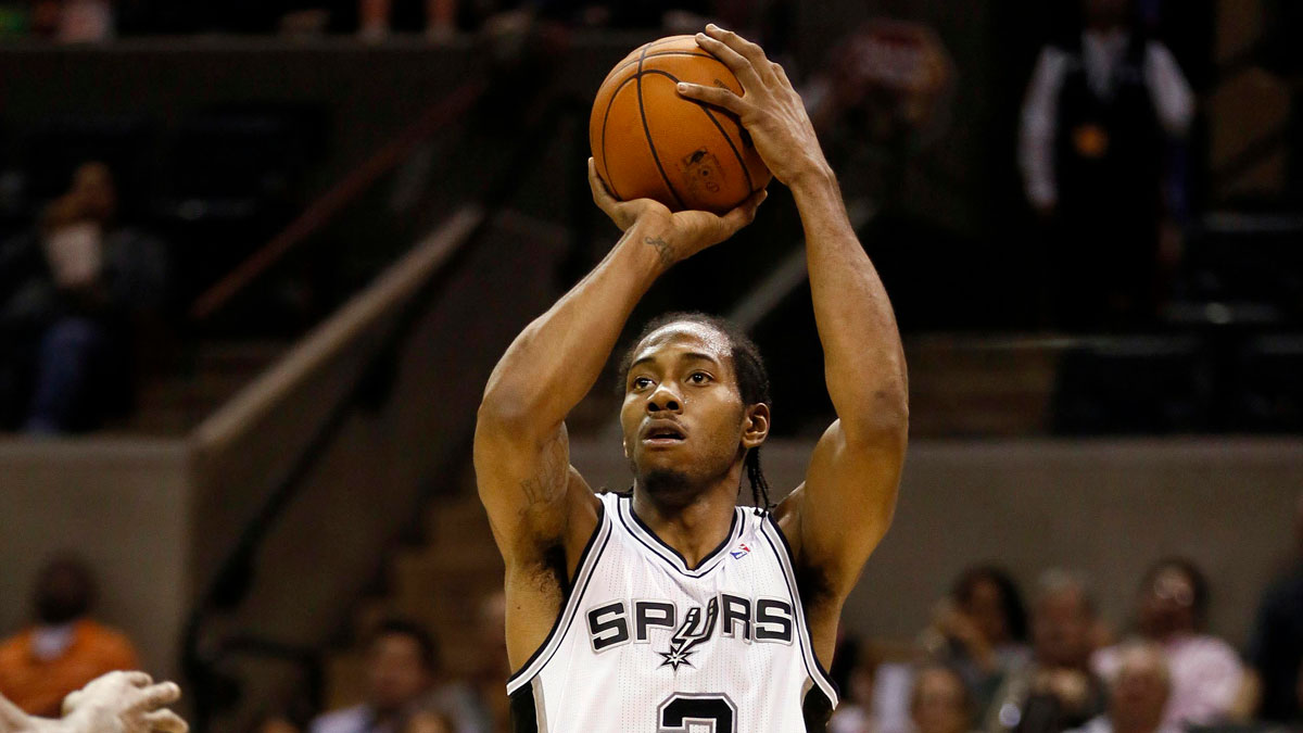 San Antonio Spurs forward Kawhi Leonard (2) shoots during the second half against the Brooklyn Nets at the AT&T Center.