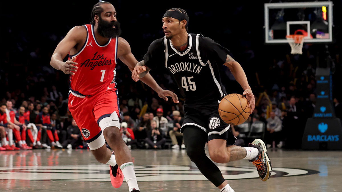 Mar 28, 2025; Brooklyn, New York, USA; Brooklyn Nets guard Keon Johnson (45) drives to the basket against Los Angeles Clippers guard James Harden (1) during the third quarter at Barclays Center. Mandatory Credit: Brad Penner-Imagn Images