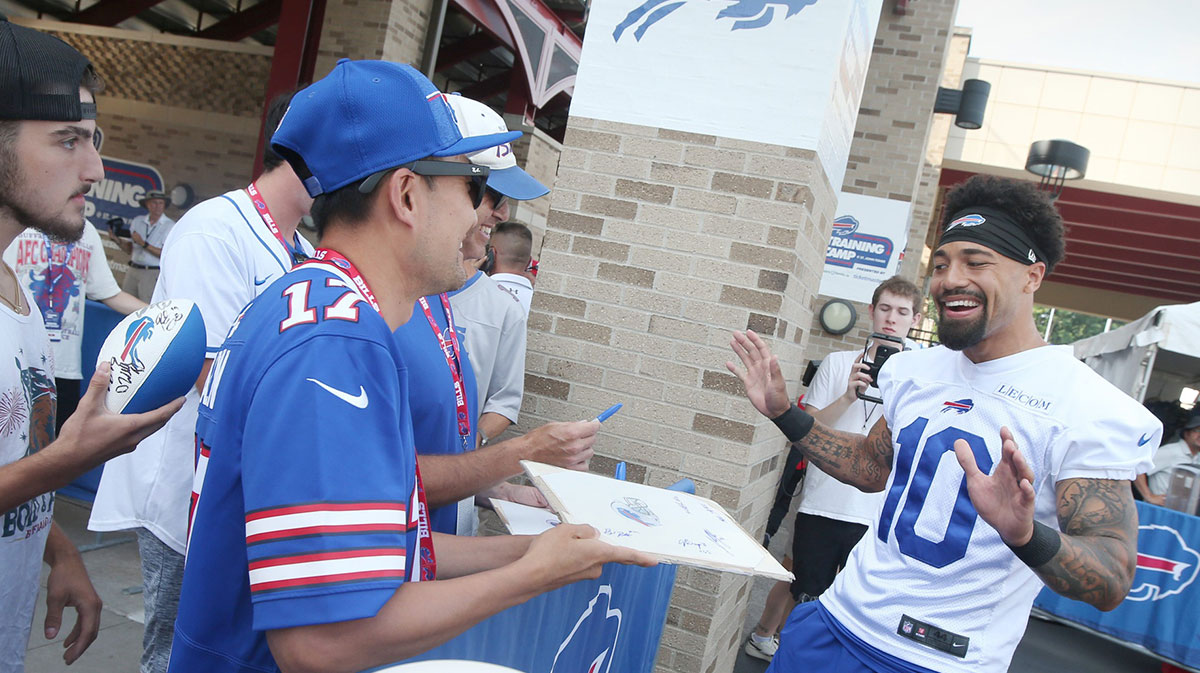 Bills wide receiver Khalil Shakir jokes with fans as he signs autographs during the second day of Buffalo Bills training camp at St. John Fisher University.