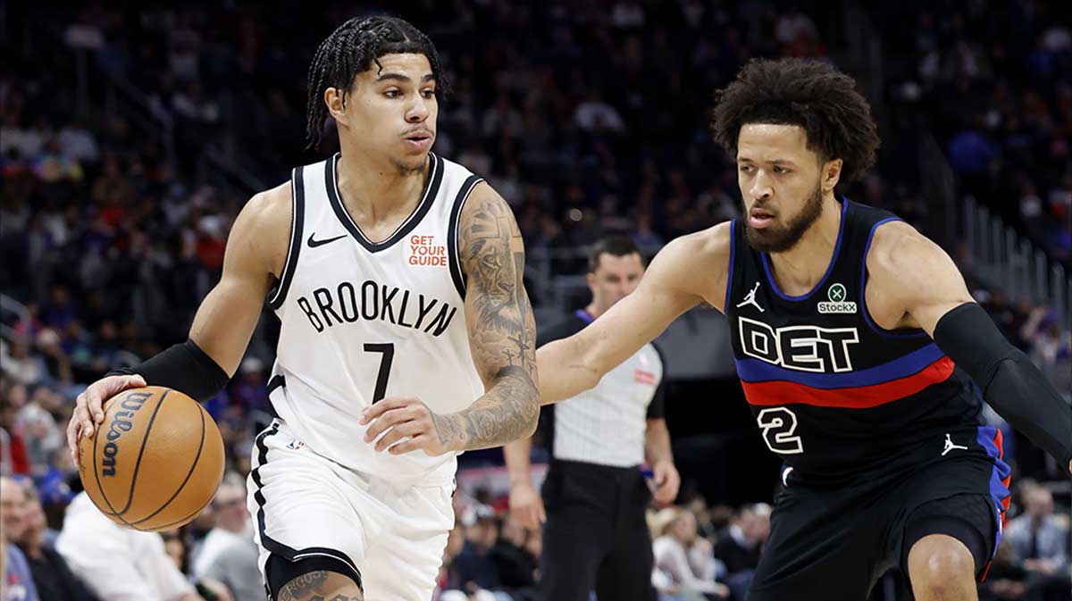 Brooklyn Nets guard Killian Hayes (7) dribbles defended by Detroit Pistons guard Cade Cunningham (2) in the first half at Little Caesars Arena.