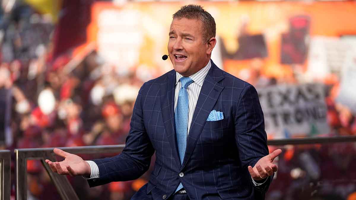 Kirk Herbstreit speaks on the set of ESPN College GameDay prior to the NCAA football game between the Ohio State Buckeyes and the Texas Longhorns at Ohio Stadium.