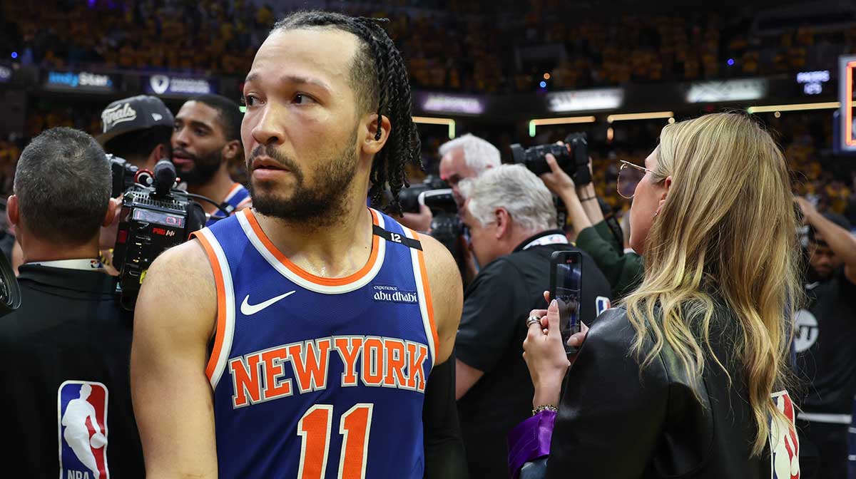 Knicks guard Jalen Brunson (11) reacts after game six of the eastern conference finals against the Indiana Pacers for the 2025 NBA Playoffs at Gainbridge Fieldhouse with Clippers' Kawhi Leonard and Pablo Torre in the background