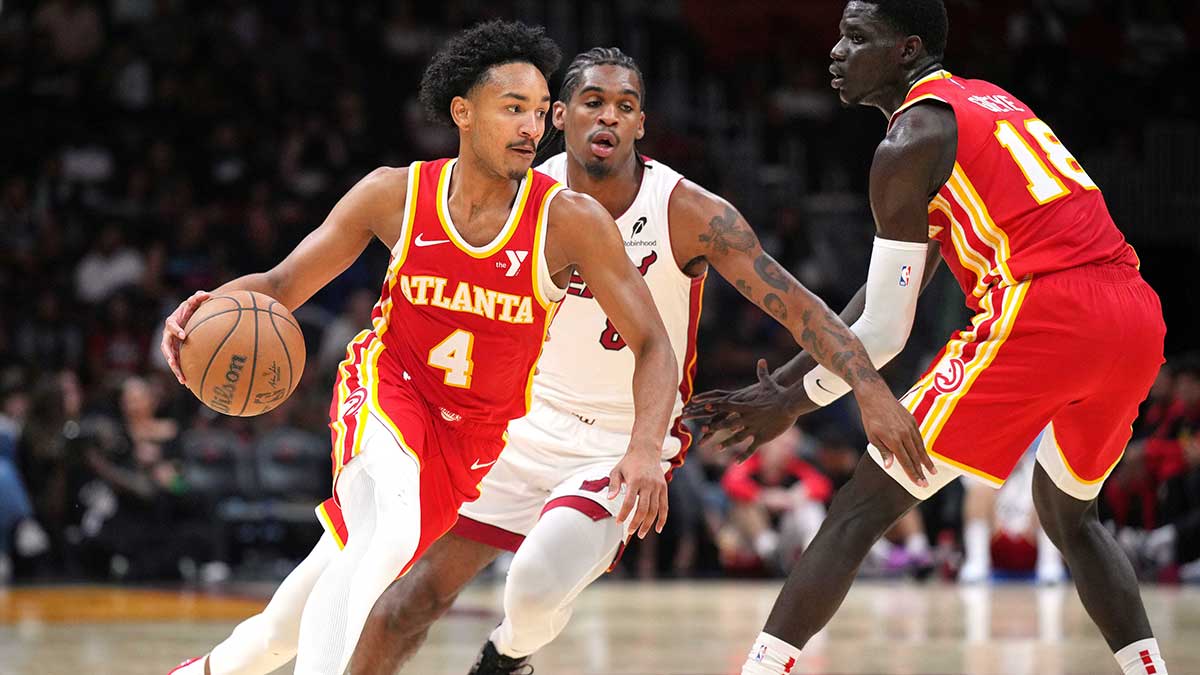 Atlanta Hawks guard Kobe Bufkin (4) brings the ball up the court against the Miami Heat in the second half at Kaseya Center.