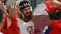 Philadelphia Phillies outfielder Kyle Schwarber (12) celebrates in the dugout after hitting his 50th home run of the season during the seventh inning against the New York Mets at Citizens Bank Park.