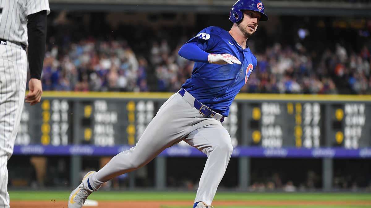 Chicago Cubs outfielder Kyle Tucker (30) rounds third base and scores during the fifth inning against the Colorado Rockies at Coors Field.