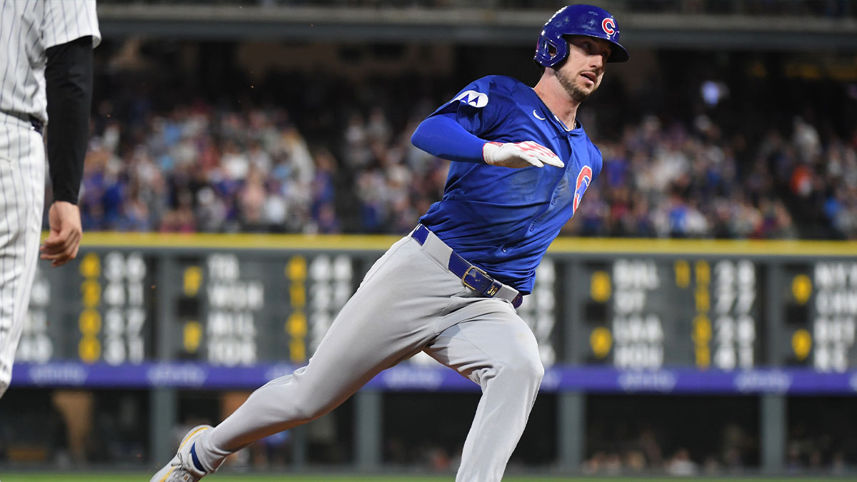 Chicago Cubs outfielder Kyle Tucker (30) rounds third base and scores during the fifth inning against the Colorado Rockies at Coors Field.