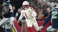 Sep 25, 2025; Glendale, Ariz., U.S.; Arizona Cardinals quarterback Kyler Murray (1) scrambles out of the backfield against the Seattle Seahawks at State Farm Stadium.