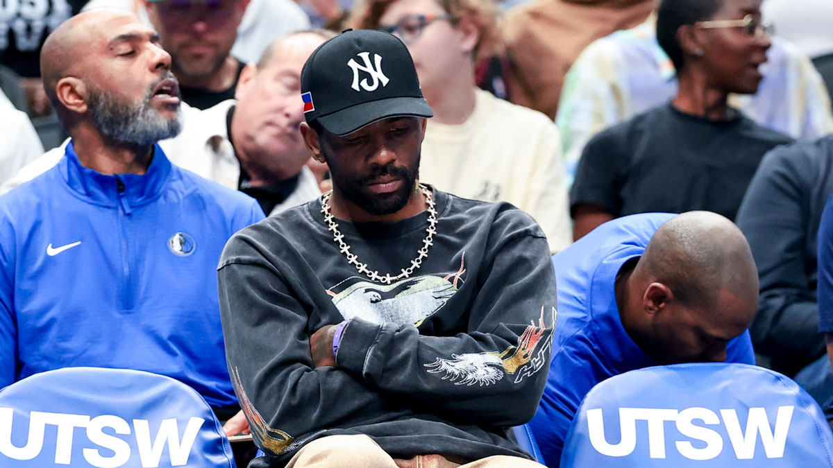 Dallas Mavericks guard Kyrie Irving sits on the bench against the Philadelphia 76ers during the first half at American Airlines Center.