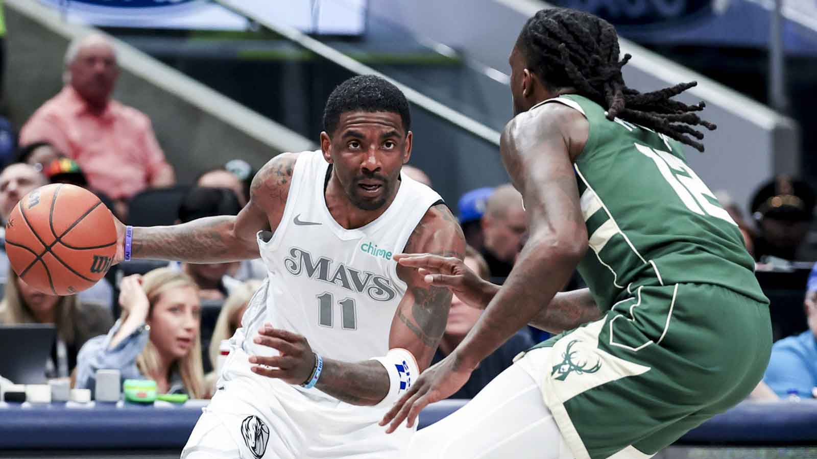 Dallas Mavericks guard Kyrie Irving (11) drives to the basket as Milwaukee Bucks forward Taurean Prince (12) defends during the first half at American Airlines Center. 