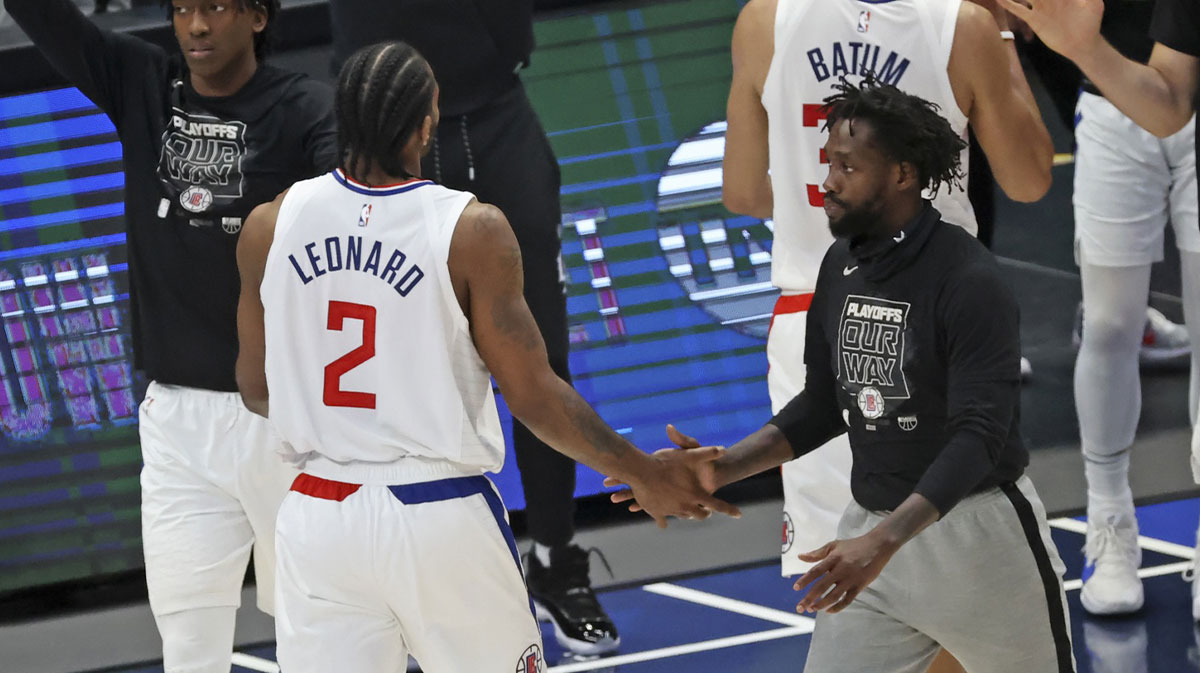 LA Clippers forward Kawhi Leonard (2) celebrate with guard Patrick Beverley (21) after the game against the Dallas Mavericks in game six in the first round of the 2021 NBA Playoffs at American Airlines Center.