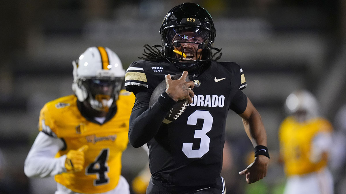 Colorado Buffaloes quarterback Kaidon Salter (3) carries the ball for a touchdown in the fourth quarter against the Wyoming Cowboys at Folsom Field.