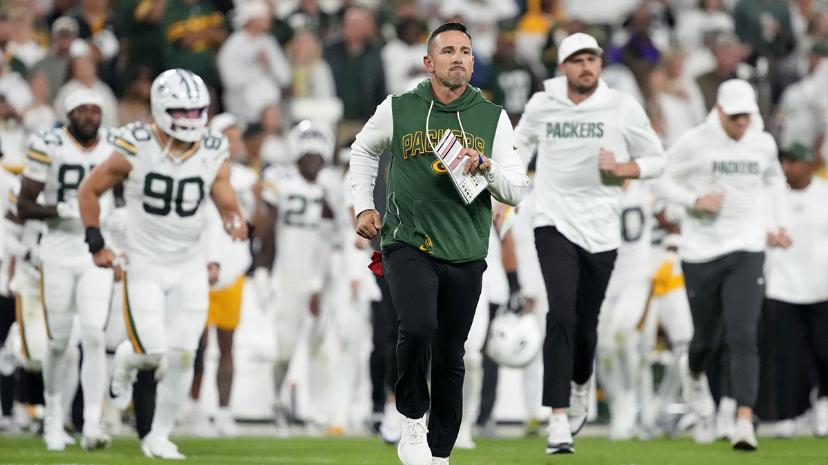 Green Bay Packers head coach Matt LaFleur leaves the field at halftime against the Washington Commanders at Lambeau Field