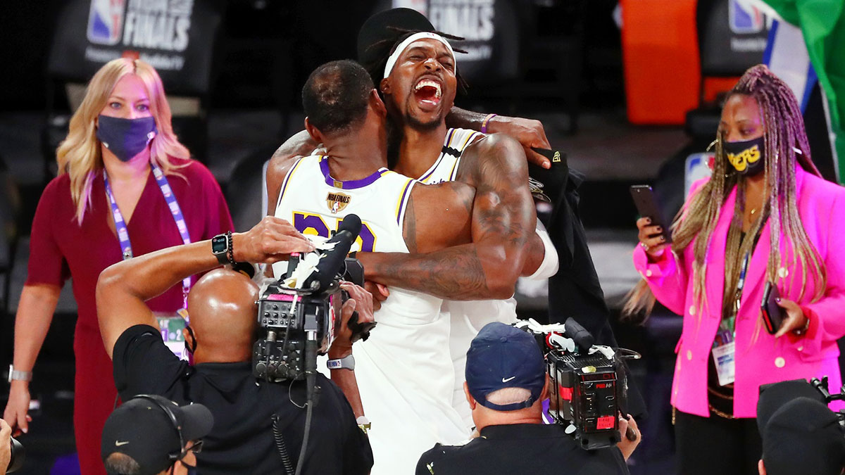 Lakers forward LeBron James (23) and center Dwight Howard (39) celebrate their win after game six of the 2020 NBA Finals at AdventHealth Arena. The Los Angeles Lakers won 106-93 to win the series