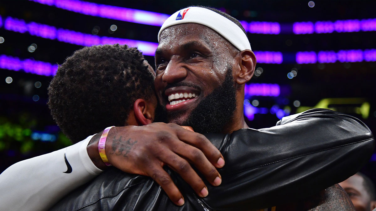 Lakers forward LeBron James (6) hugs agent Rich Paul after breaking the all-time scoring record in the third quarter against the Oklahoma City Thunder at Crypto.com Arena