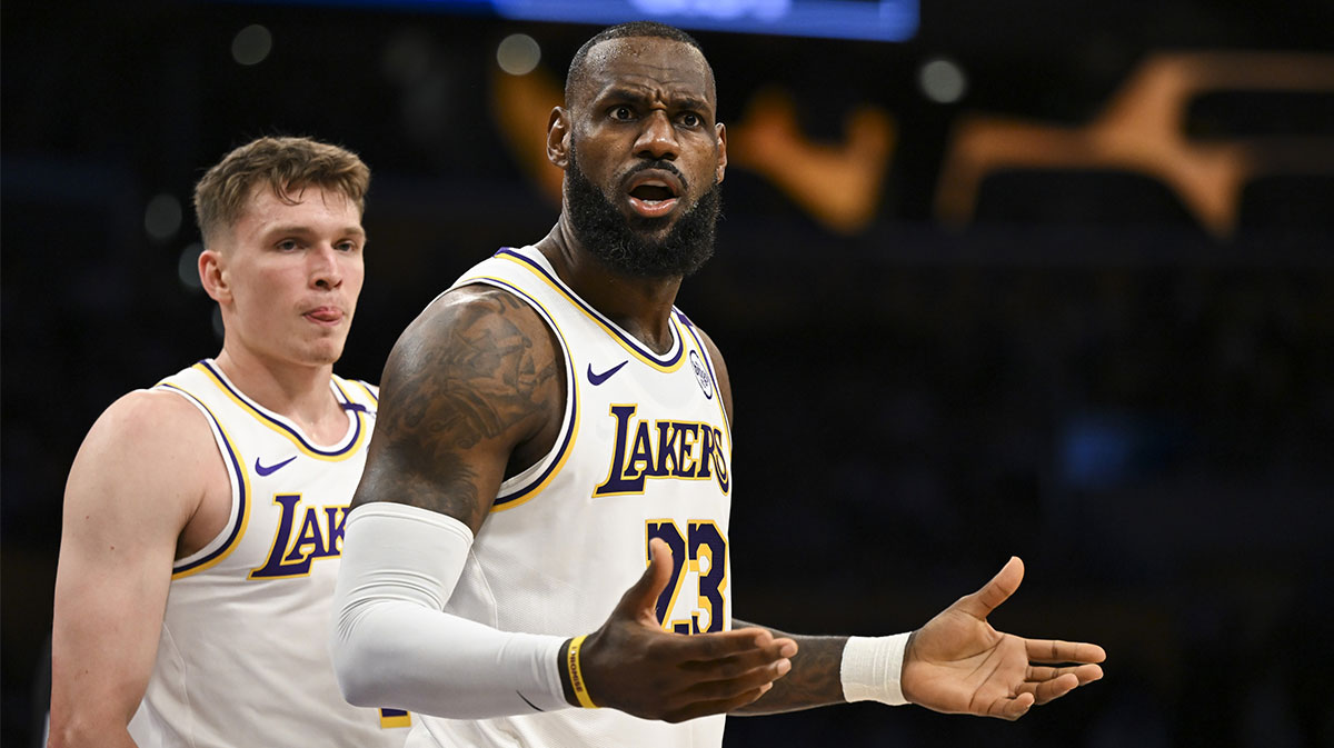 Lakers forward LeBron James (23) and guard Dalton Knecht (4) react