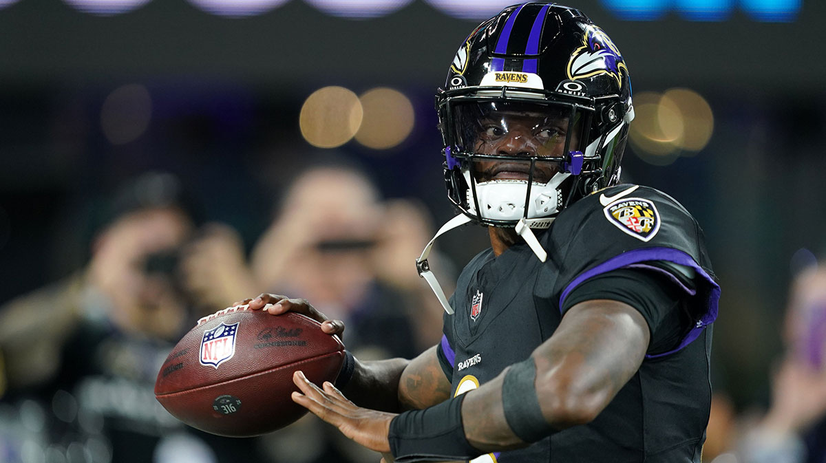 Baltimore Ravens quarterback Lamar Jackson (8) practices before the game against the Detroit Lions at M&T Bank Stadium.