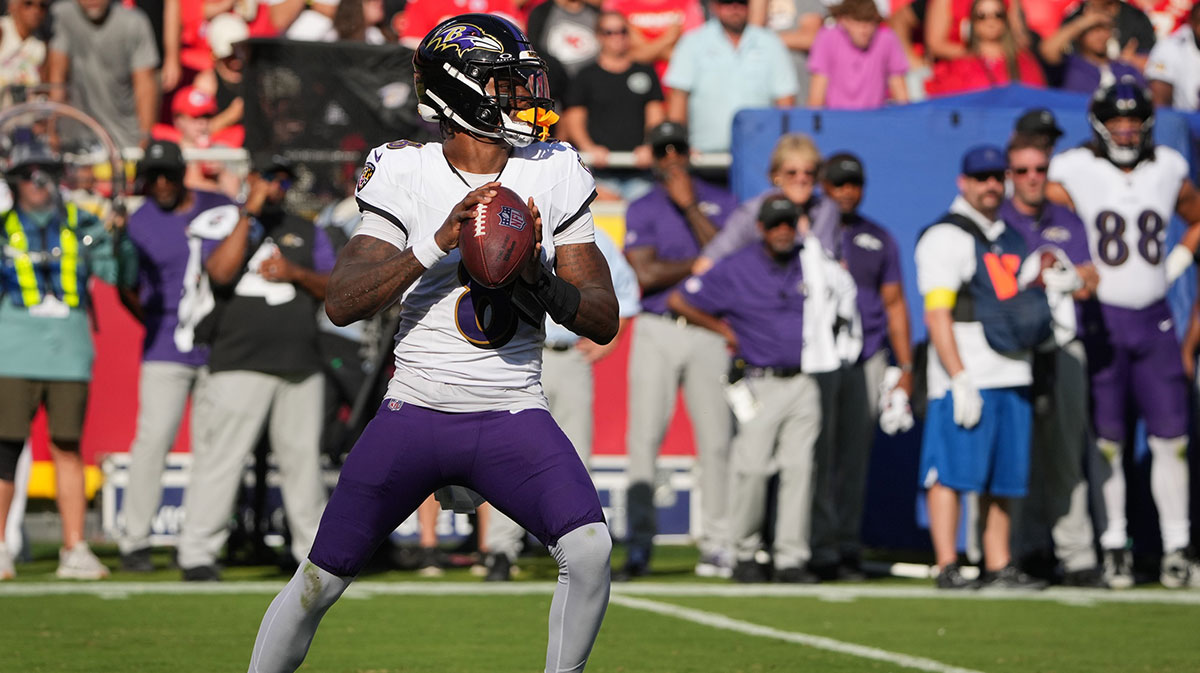 Baltimore Ravens quarterback Lamar Jackson (8) drops back to pass during the first half against the Kansas City Chiefs at GEHA Field at Arrowhead Stadium.
