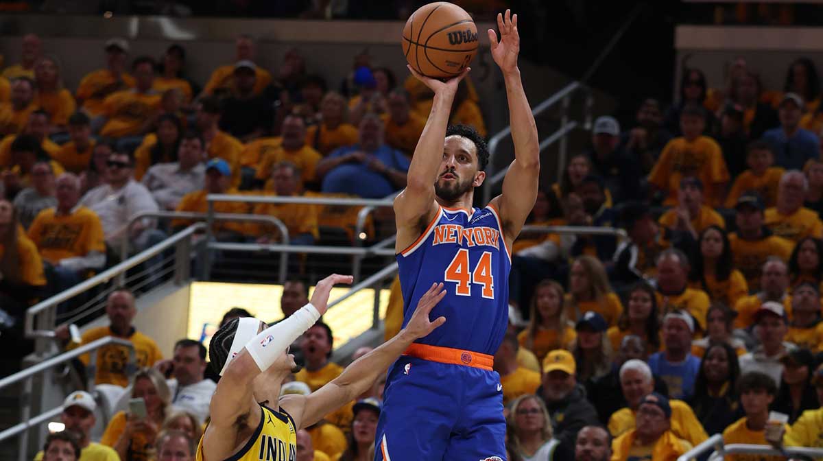 New York Knicks guard Landry Shamet (44) shoots a layup over Indiana Pacers guard Andrew Nembhard (2) during the second quarter of game three of the eastern conference finals for the 2025 NBA Playoffs at Gainbridge Fieldhouse.