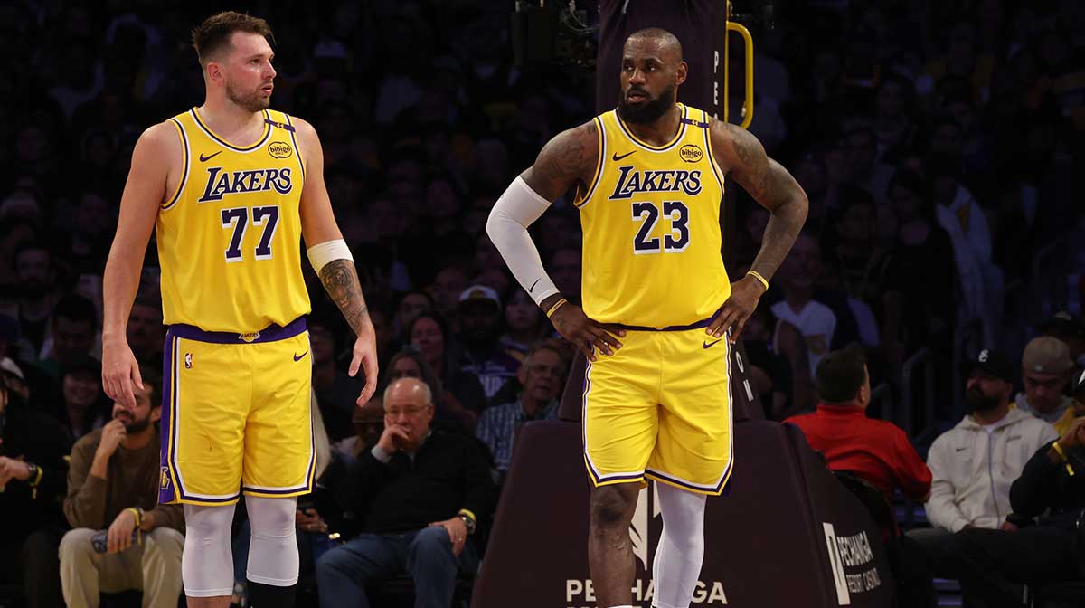 Los Angeles Lakers guard Luka Doncic (77) and forward LeBron James (23) during the second quarter against the Minnesota Timberwolves at Crypto.com Arena. 