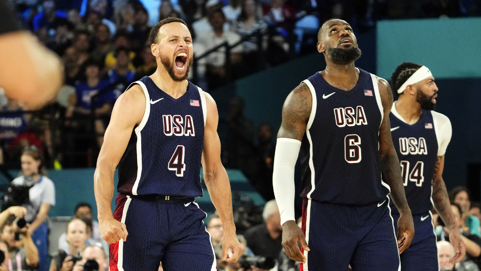 shooting guard Stephen Curry (4) and guard LeBron James (6) react in the second half against France in the men's basketball gold medal game during the Paris 2024 Olympic Summer Games at Accor Arena. 