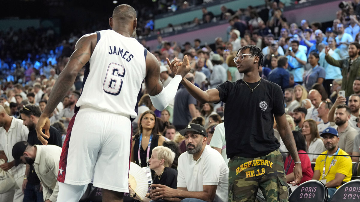 United States guard LeBron James (6) shakes hands with son Bryce James against Serbia in a men's basketball semifinal game during the Paris 2024 Olympic Summer Games at Accor Arena.