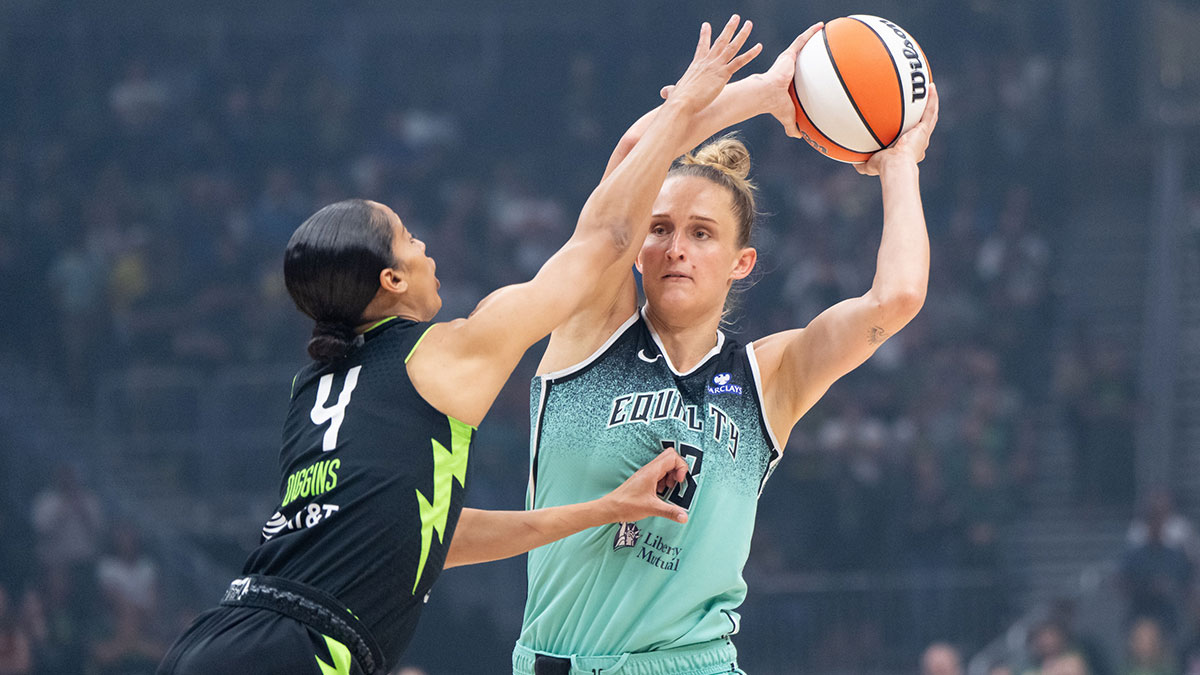 New York Liberty forward Leonie Fiebich (13) looks to pass agianst Seattle Storm guard Skylar Diggins (4) during the first half at Climate Pledge Arena.
