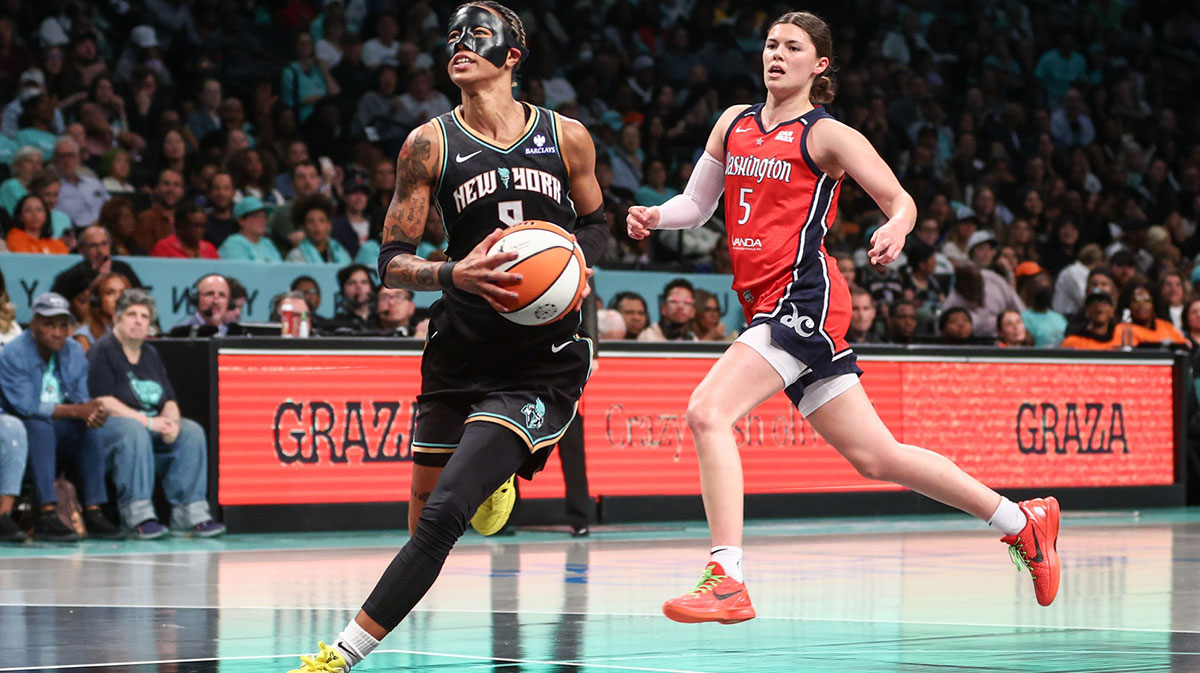 New York Liberty guard Natasha Cloud (9) drives past Washington Mystics guard Jade Melbourne (5) in the third quarter at Barclays Center.