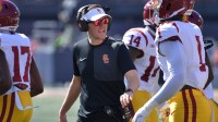 Southern California Trojans head coach Lincoln Riley talks with players during the first half against the Illinois Fighting Illini at Memorial Stadium.