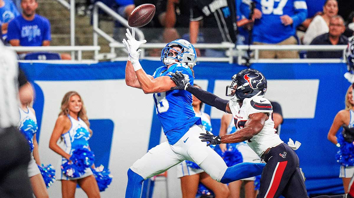 Detroit Lions wide receiver Isaac TeSlaa (18) makes a catch for a touchdown against Houston Texans cornerback D'Angelo Ross (37) during the first half at Ford Field in Detroit on Saturday, August 23, 2025.