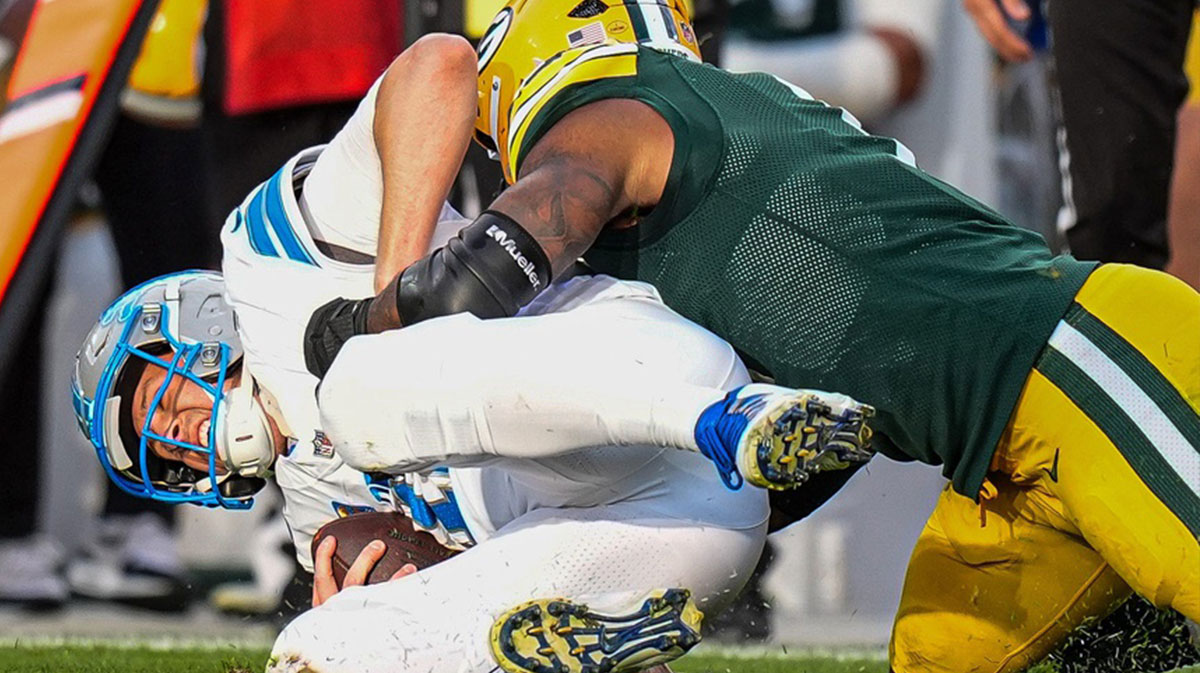 Detroit Lions quarterback Jared Goff is sacked by Green Bay Packers defensive end Micah Parsons during the second half at Lambeau Field.