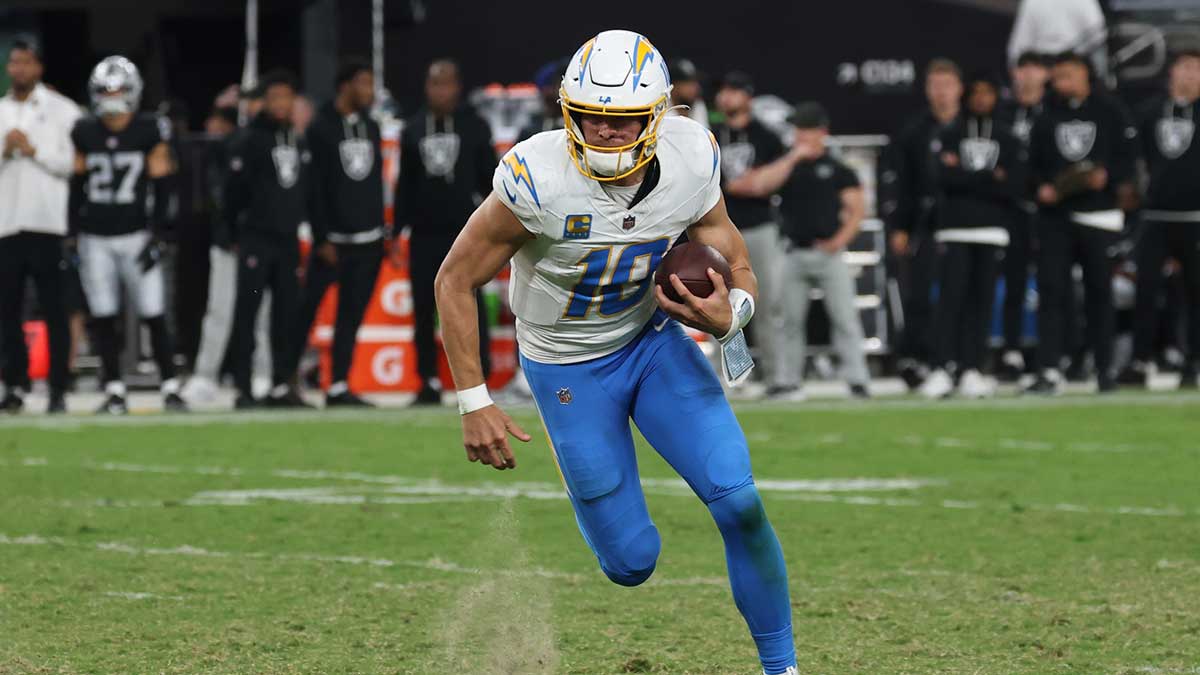 Los Angeles Chargers quarterback Justin Herbert (10) rushes during the fourth quarter against the Las Vegas Raiders at Allegiant Stadium.