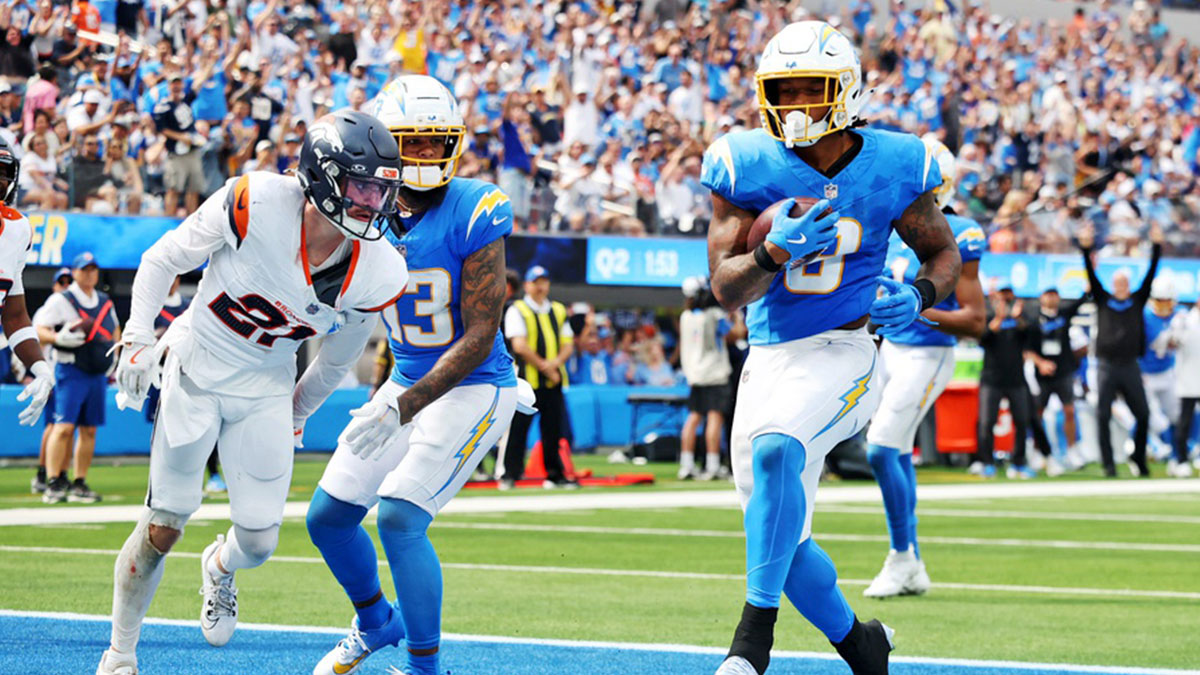 Sep 21, 2025; Inglewood, California, USA; Los Angeles Chargers running back Omarion Hampton (8) makes a touchdown during the first half against the Denver Broncos at SoFi Stadium. Mandatory Credit: William Navarro-Imagn Images