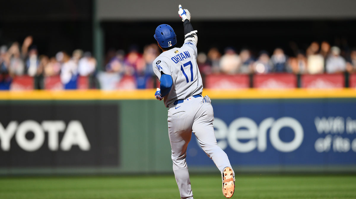 Los Angeles Dodgers designated hitter Shohei Ohtani (17) points to the bullpen while running the bases after hitting a home run against the Seattle Mariners during the seventh inning at T-Mobile Park.