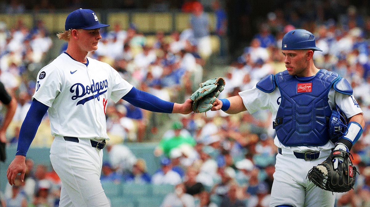 Los Angeles Dodgers starting pitcher Emmet Sheehan (80) is greeted by catcher Dalton Rushing (68) during the seventh inning against the San Francisco Giants at Dodger Stadium.